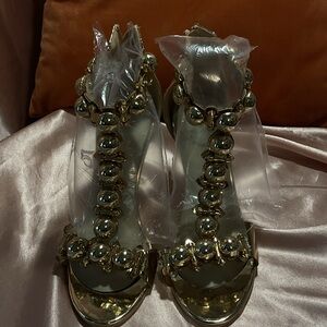 Golden studded heels.